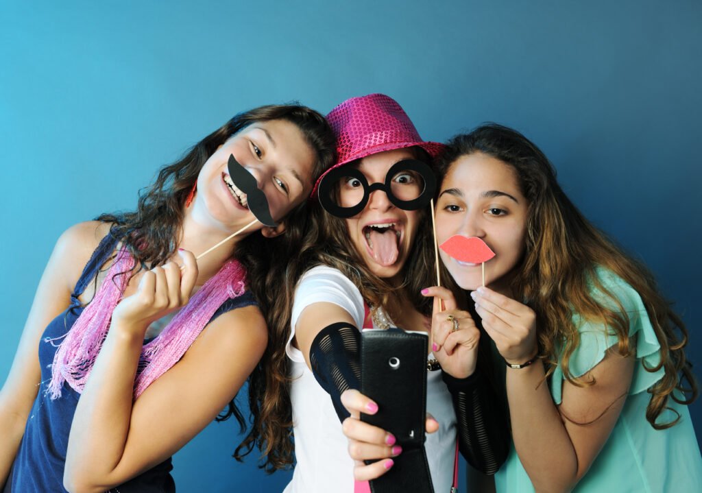 Guests posing with photo booth props