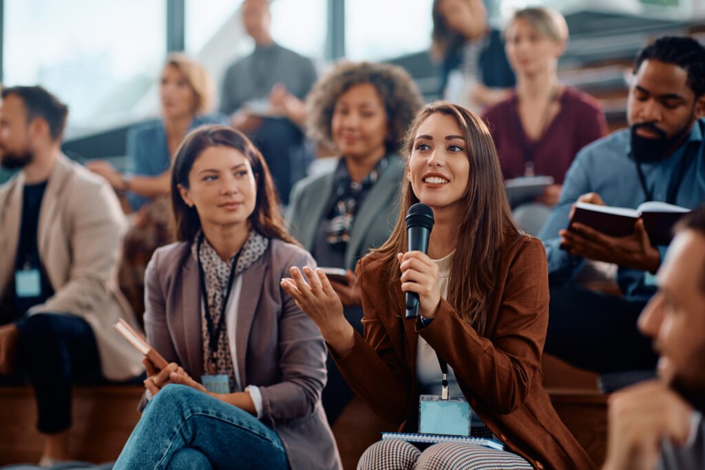 Speaker using a microphone at a conference event